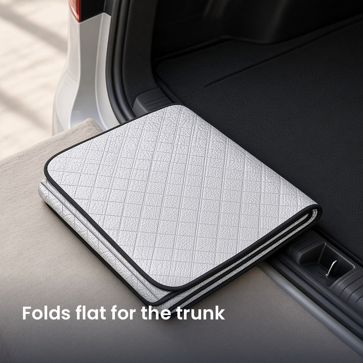 DawnClear™ windshield cover folded flat for storage in the trunk