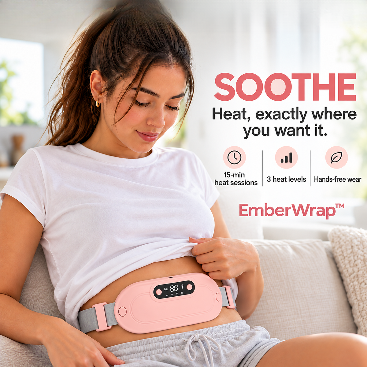EmberWrap™ cordless heating wrap in pink, worn around the waist over a white tee