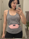 Customer wearing the pink EmberWrap™ cordless heating belt – mirror selfie in bathroom