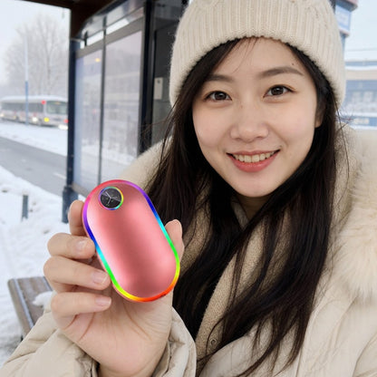 FrostGrip™ rechargeable hand warmer held outdoors on a winter day