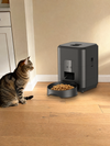 Pet beside a Midnight Black PawPort™ Wi-Fi Feeder at home