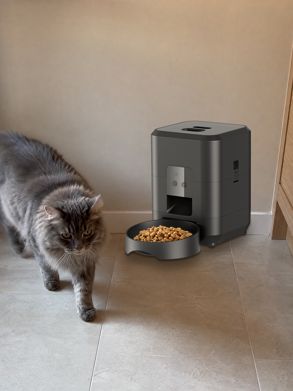 Pet beside a Midnight Black PawPort™ Wi-Fi Feeder at home